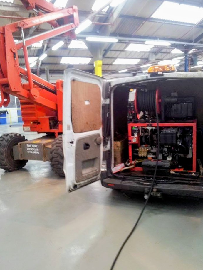Rear of the Retro-Cleanse van showing jetting equipment and hose reel