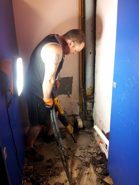 Retro-Cleanse technician clearing an indoor drain run